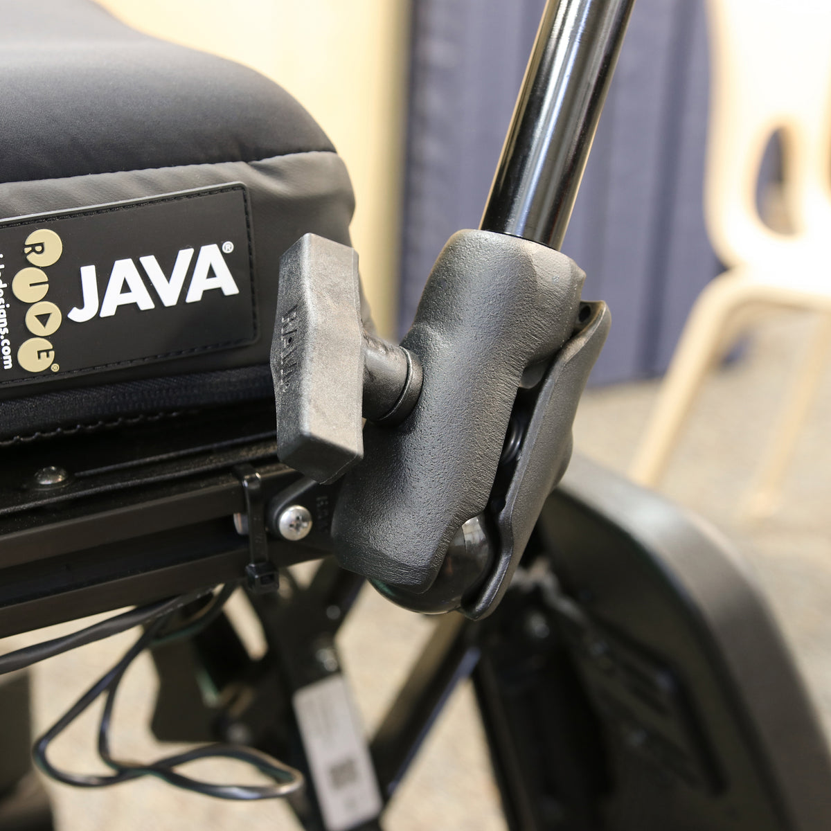RAM-200-9-BC-201 pipe extension shown on a wheelchair with separately sold mounting base