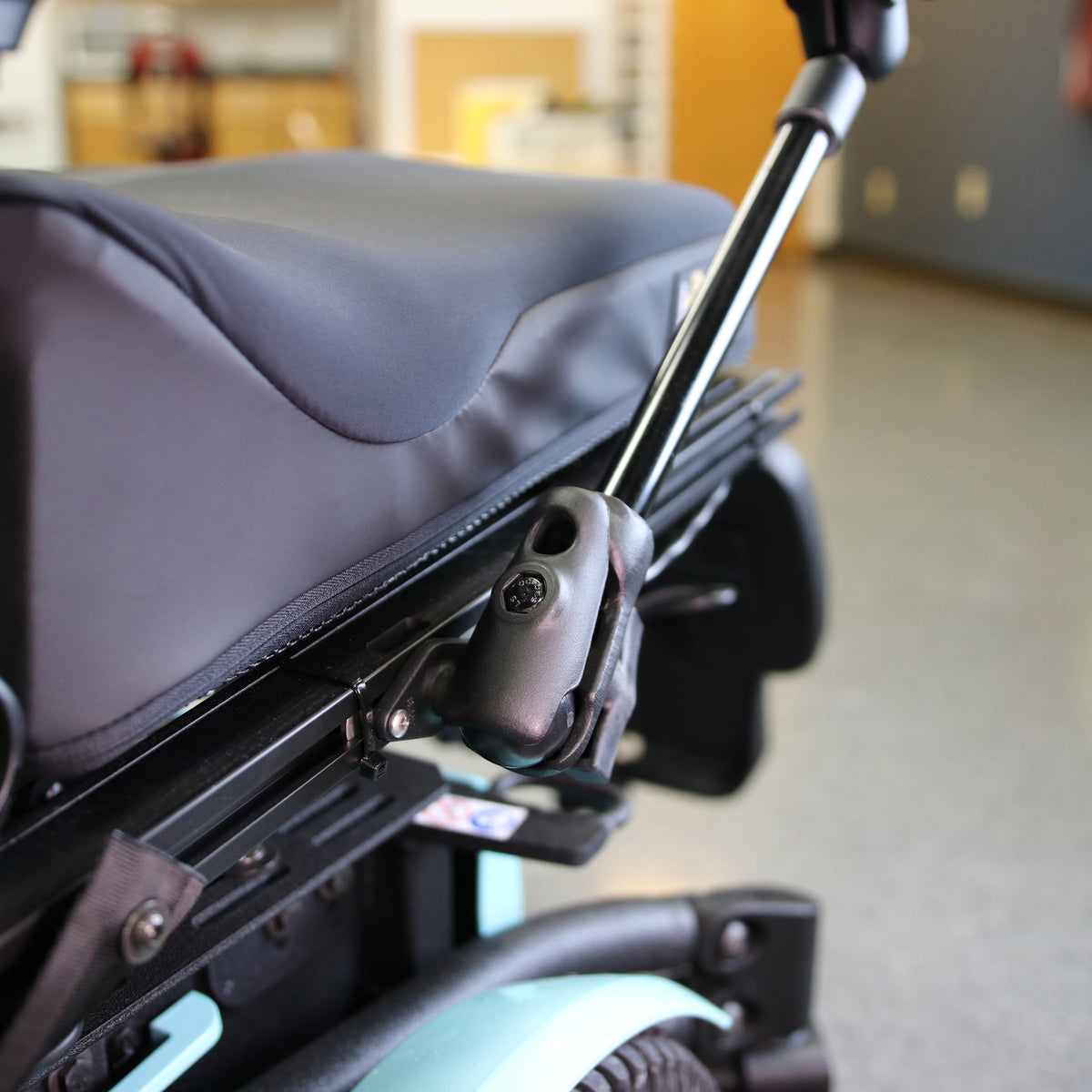 RAM-200-9-BC-201 pipe extension shown on a wheelchair with separately sold mounting base