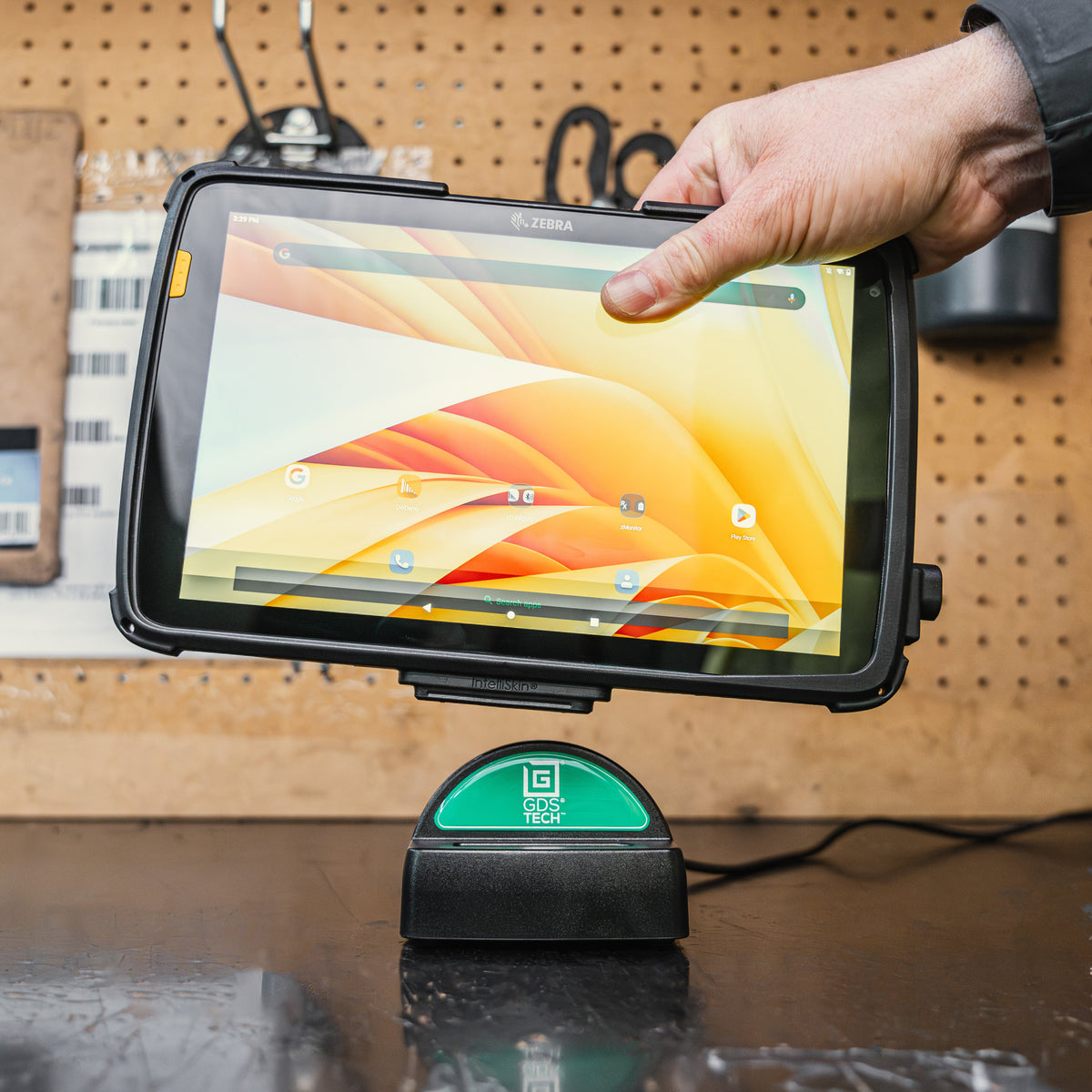 RAM-GDS-DOCK-D9U large tablet being lowered into the desktop dock; tablet and IntelliSkin sold separately